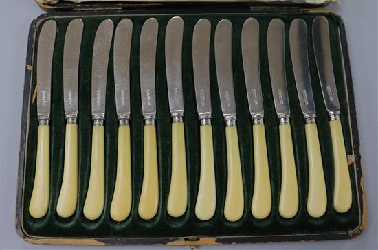 A cased set of twelve ivory handled silver dessert knives, Walker & Hall, Sheffield, 1921.
